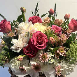Bouquet of pink and cream roses with white lilies and tulips