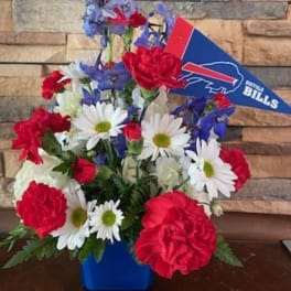 Bouquet of red, white, and blue flowers with a Buffalo Bills pennant