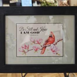 Framed print with a red bird and pink blossoms and a Bible verse