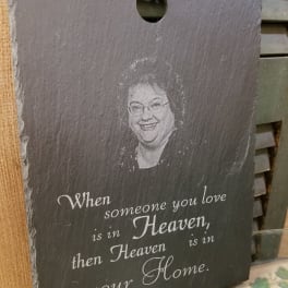 Slate memorial plaque with a portrait and sympathy quote