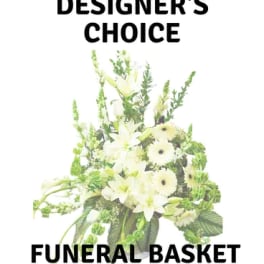 White floral funeral basket with lilies and green accents