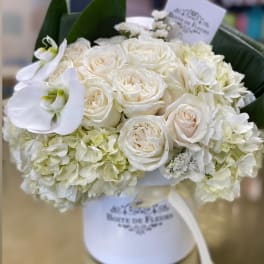 White rose bouquet with hydrangeas and calla lilies in a white box