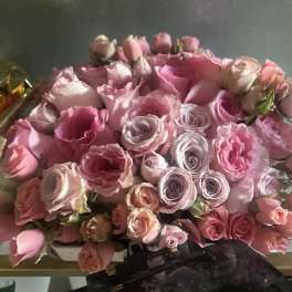 Bouquet of pink and lavender roses with a few pale buds