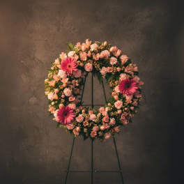 Pink floral wreath on a standing easel