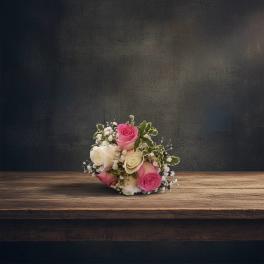 Small bouquet of pink and white roses with baby's breath