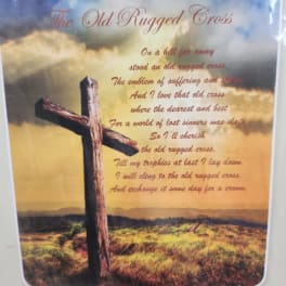 Printed wall art with a wooden cross and poem text