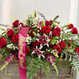 Large red rose and lily arrangement with a pink "Beloved Dad" ribbon