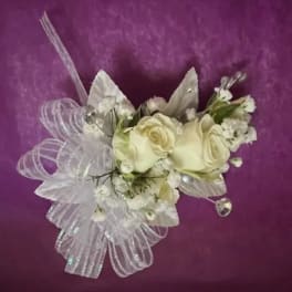 White rose corsage with sheer ribbon and small white accents