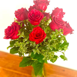 Bouquet of red roses in a glass vase