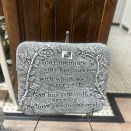 Decorative memorial plaque on a stand with a sympathy quote
