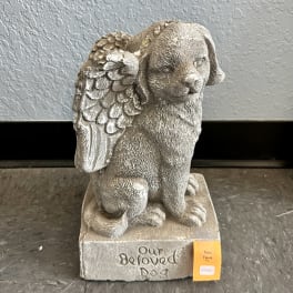 Stone dog figurine with angel wings on a square base
