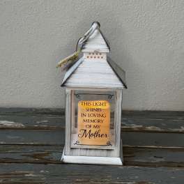 White lantern with a memorial message for Mother