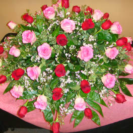 Large bouquet of pink and red roses on a table