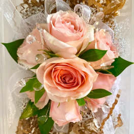 Bouquet of pale pink roses with clear decorative accents and ribbon