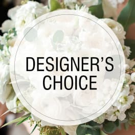 White floral bouquet with a "Designer’s Choice" label over it