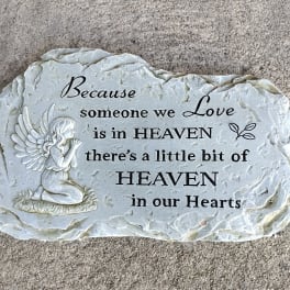 Memorial stone with an angel and a sympathy quote