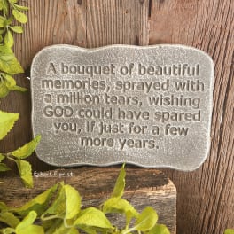 Stone memorial plaque with an engraved sympathy message