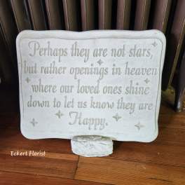 White memorial plaque with an engraved sympathy quote on a stand