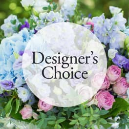 Mixed bouquet of pastel flowers with a Designer's Choice label