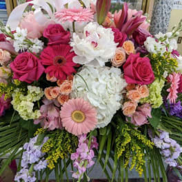 Large bouquet of pink, white, and purple flowers with lilies and roses