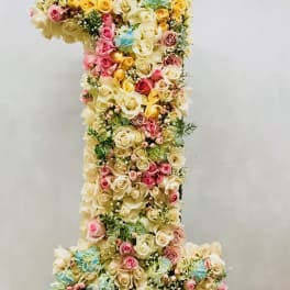 Large floral number one made of pastel roses and hydrangeas