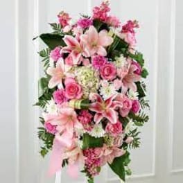 Pink and white floral standing spray with lilies and roses