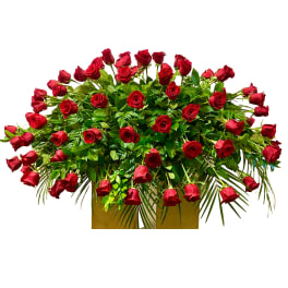 Large arrangement of red roses in a rectangular container