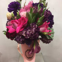 Bouquet of pink and purple flowers in a pink wrap