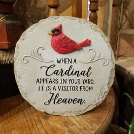 Decorative stone plaque with a red cardinal and memorial text