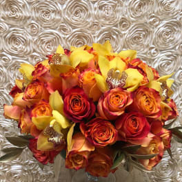 Bouquet of orange and red roses with yellow orchids