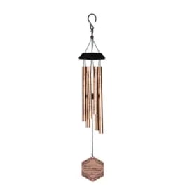Hanging metal wind chime with copper tubes and a hexagonal tag