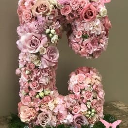 Pink floral letter arrangement with roses and hydrangeas