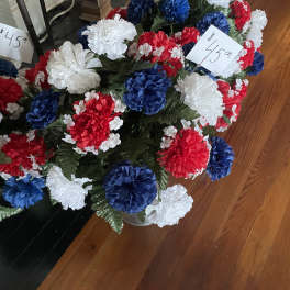 Red, white, and blue carnation arrangement in a vase
