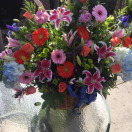 Large mixed flower basket with lilies, gerberas, roses, and hydrangeas