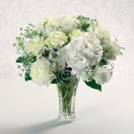 White floral bouquet in a clear glass vase