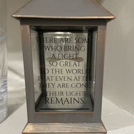 Decorative lantern with a memorial quote inside
