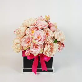 Pink and cream rose bouquet in a black gift box with a bright ribbon