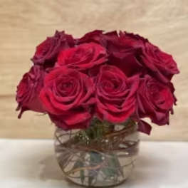 Bouquet of deep red roses in a clear glass vase