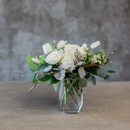 White floral arrangement in a clear glass vase