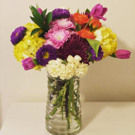 Colorful mixed bouquet in a clear glass vase