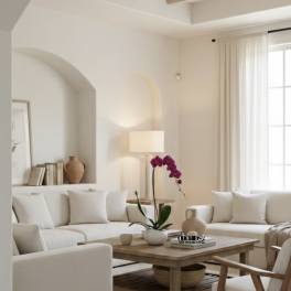 Potted purple orchid on a coffee table in a bright living room
