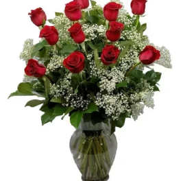 Red roses and baby's breath in a glass vase