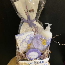 Lavender-themed gift basket with soaps, lotion, and sachets