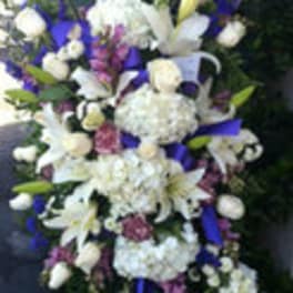 Tall white and purple floral spray with lilies and hydrangeas