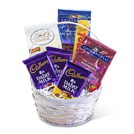 Basket of assorted chocolate bars and candy packages