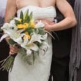 Bride holding a white and yellow wedding bouquet