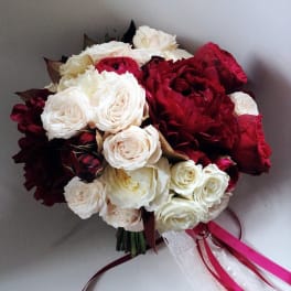 Bouquet of red and white roses with ribbon