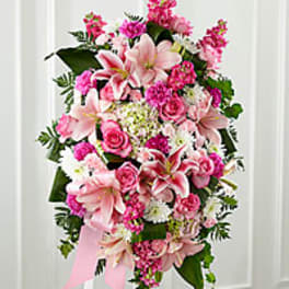 Pink and white floral standing spray with lilies and roses