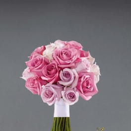 Pink and lavender rose bouquet with white wrapping