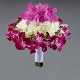Pink and white orchid bouquet with a wrapped handle